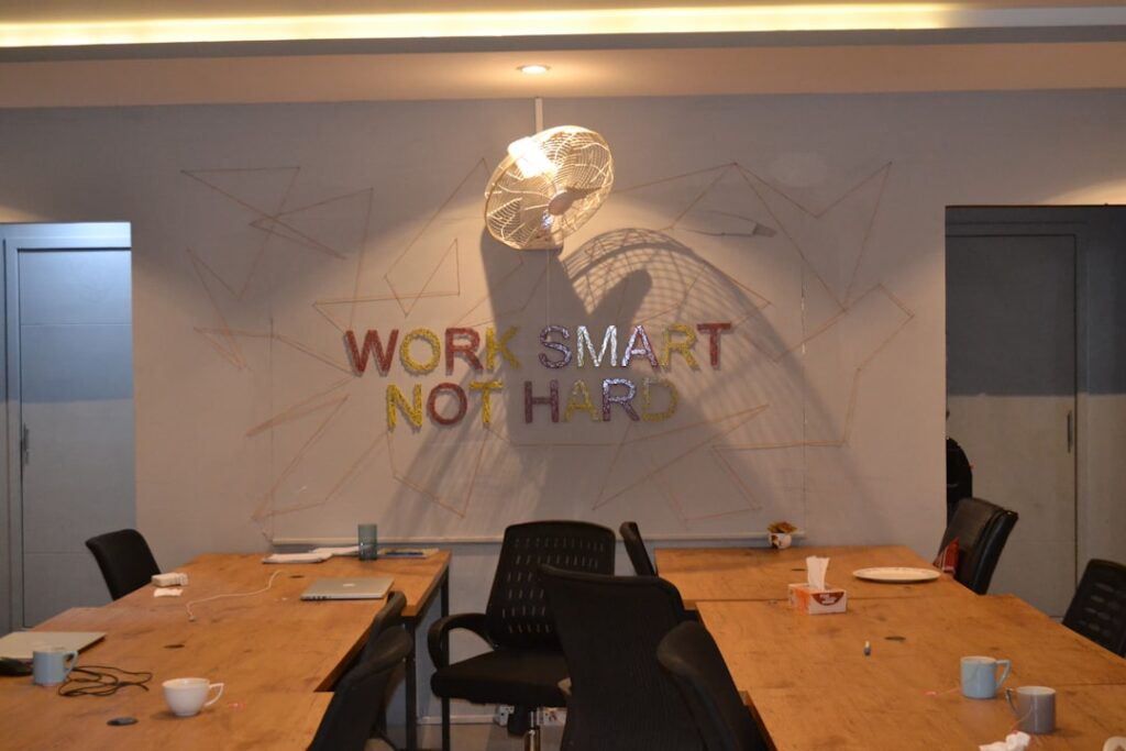 Notion AI 무료 플랜 한계 - A conference room with a large wooden table and chairs