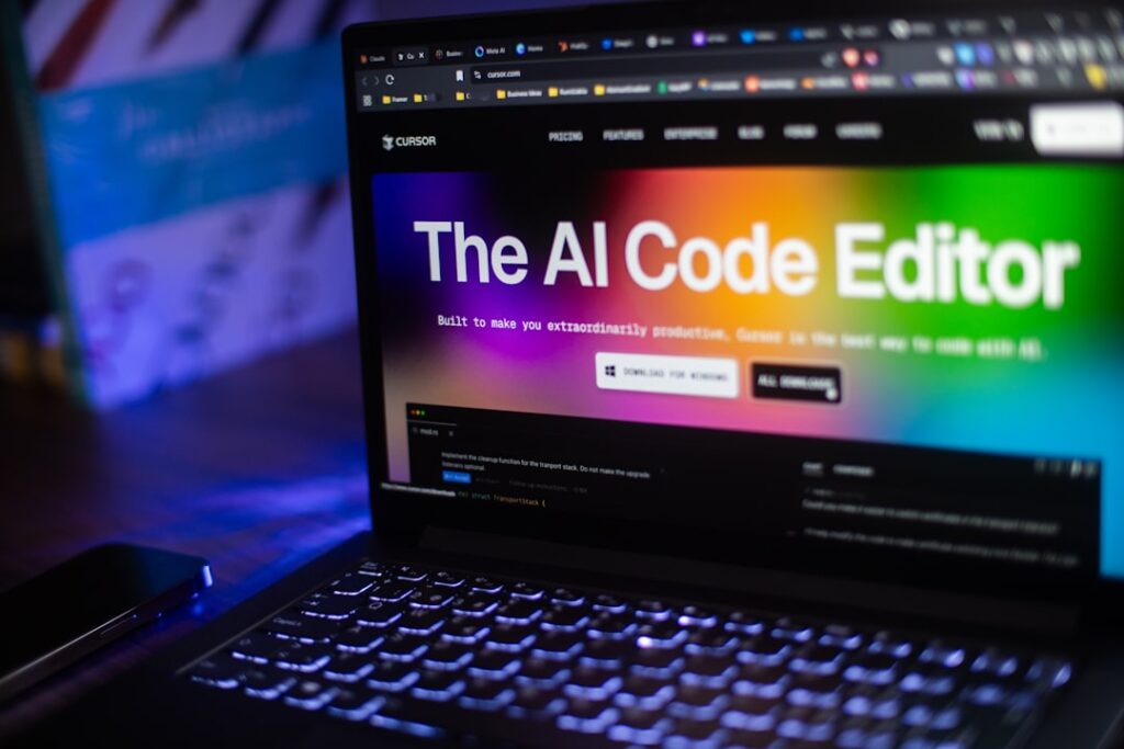 GPT-4o-mini로 하루 15분 투자해 AI 최신 트렌드 리포트 발행 - Laptop displays "the ai code editor" website.
